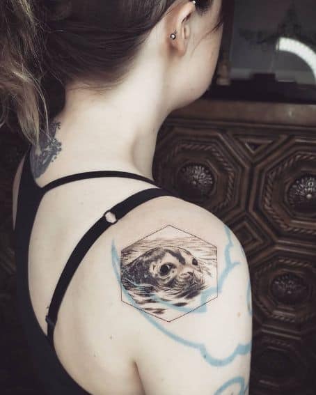 Suspicious Seal Tattoo on Shoulder