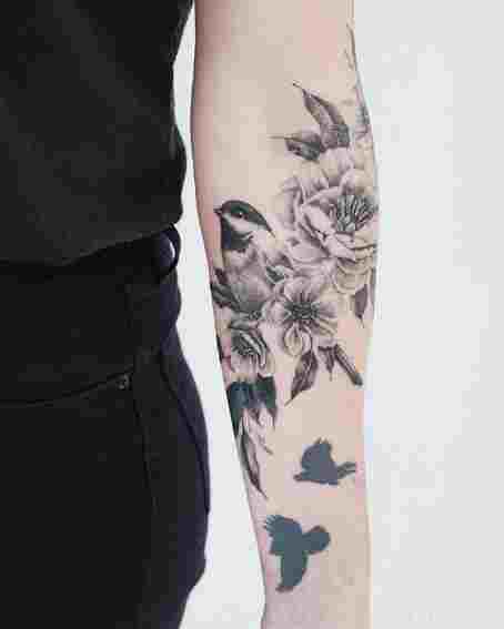 Tattoo of Black Chickadee with Flowers