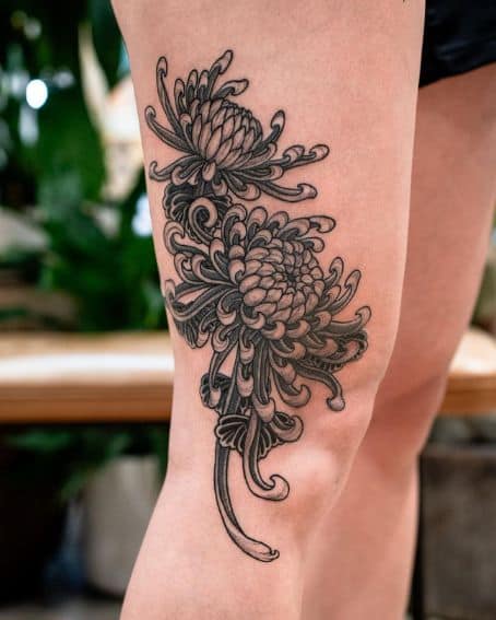 Tattoo of Two Big Chrysanthemums on the Thigh