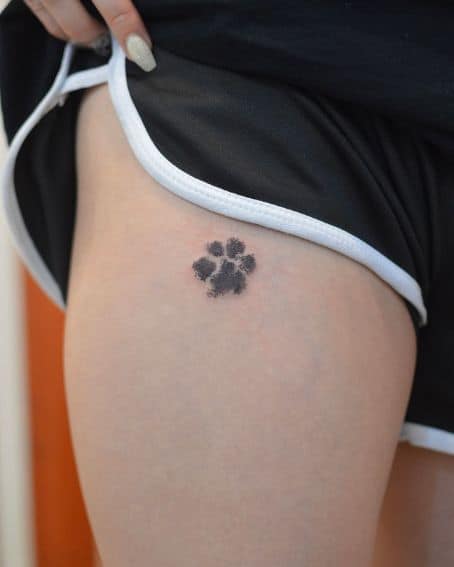 Tiny Animal Footprint Tattoo on Thigh