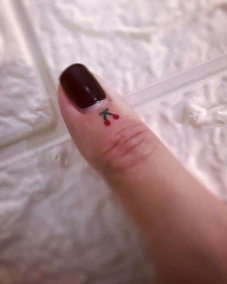 TIny Cherry Tattoo on Finger