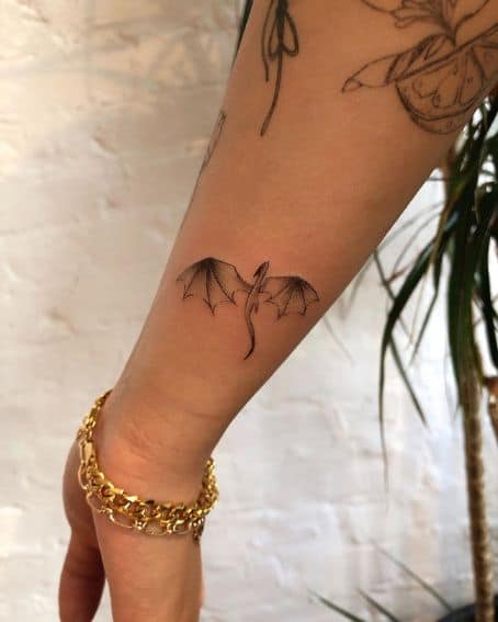 Tiny Dragon Tattoo on Wrist