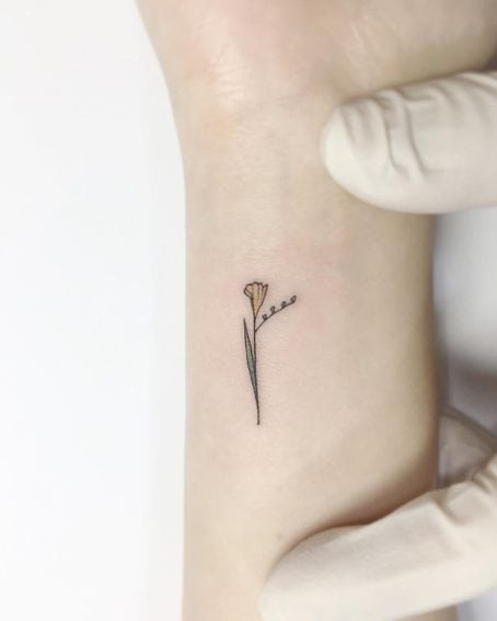 Tiny Freesia Tattoo on Wrist