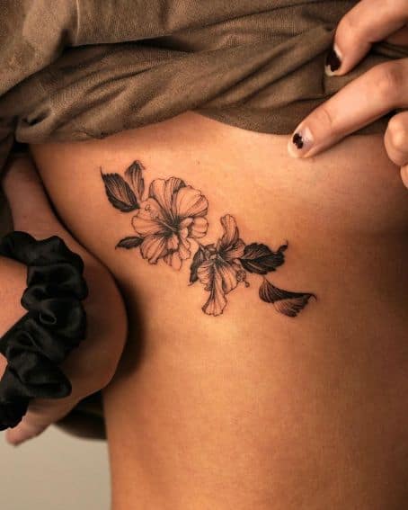 Two Hibiscus Tattoos on the Waist